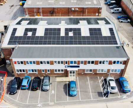 aerial shot of solar installation on building roof