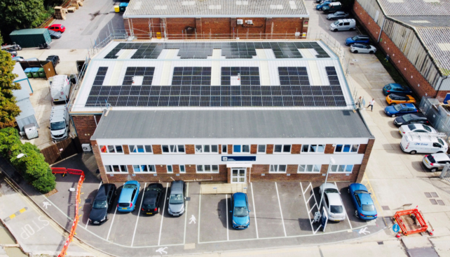 aerial shot of solar installation on building roof